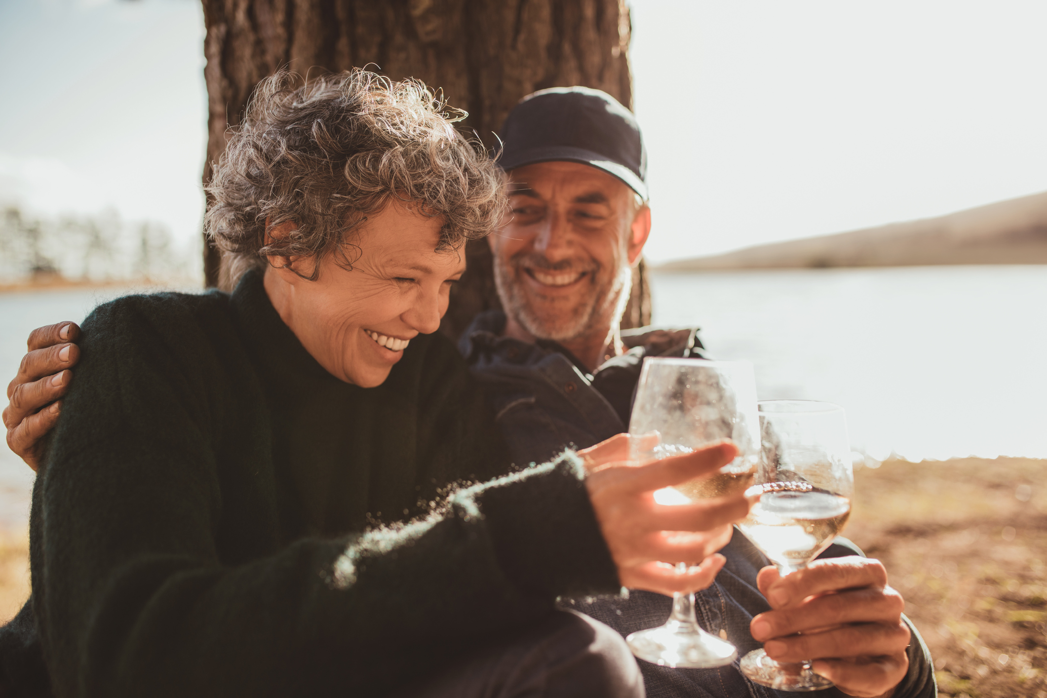Older couple drinking wine outdoors