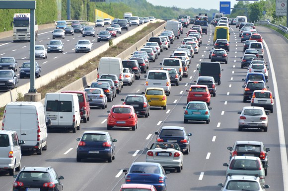 Picture of cars in traffic on the highway.