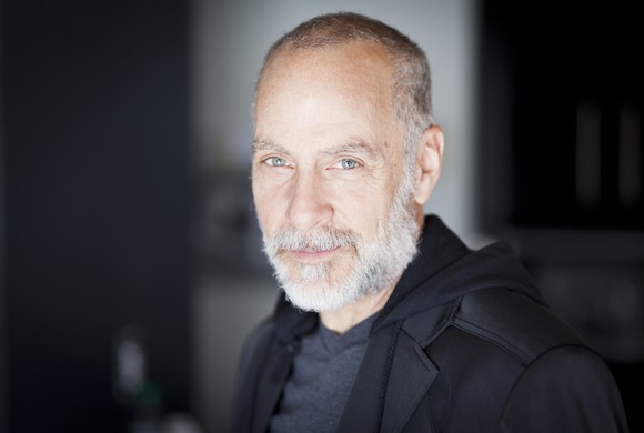 Older man with a serious smile