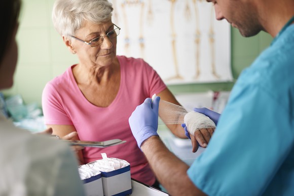 Senior woman getting medical treatment.