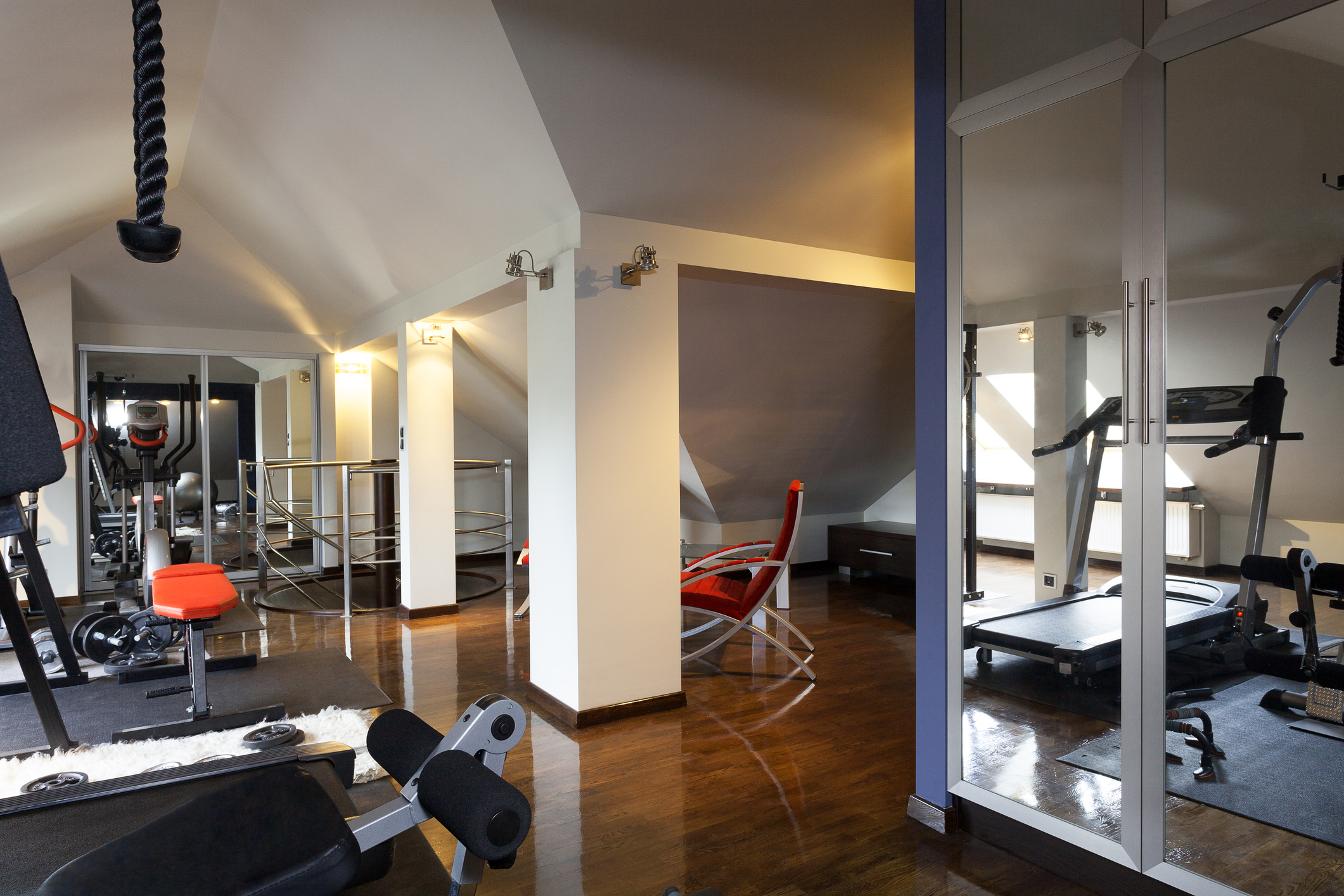 Home gym with workout equipment.