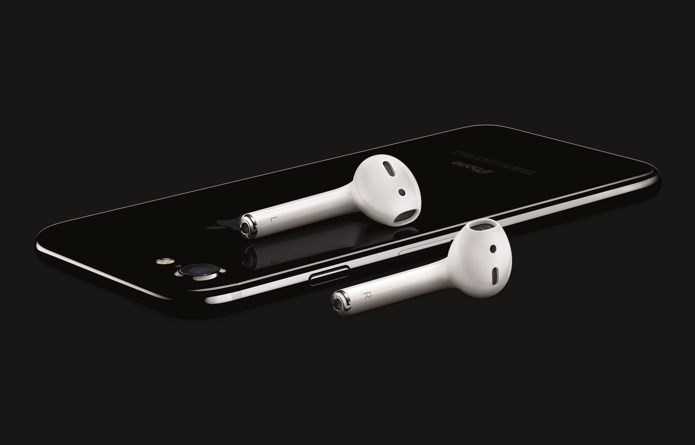 Apple's iPhone 7 in Jet Black with a pair of AirPod wireless earbuds.