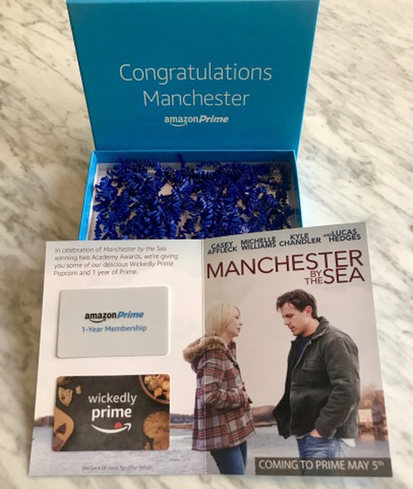 Gift box containing two gift cards on card showing movie image.