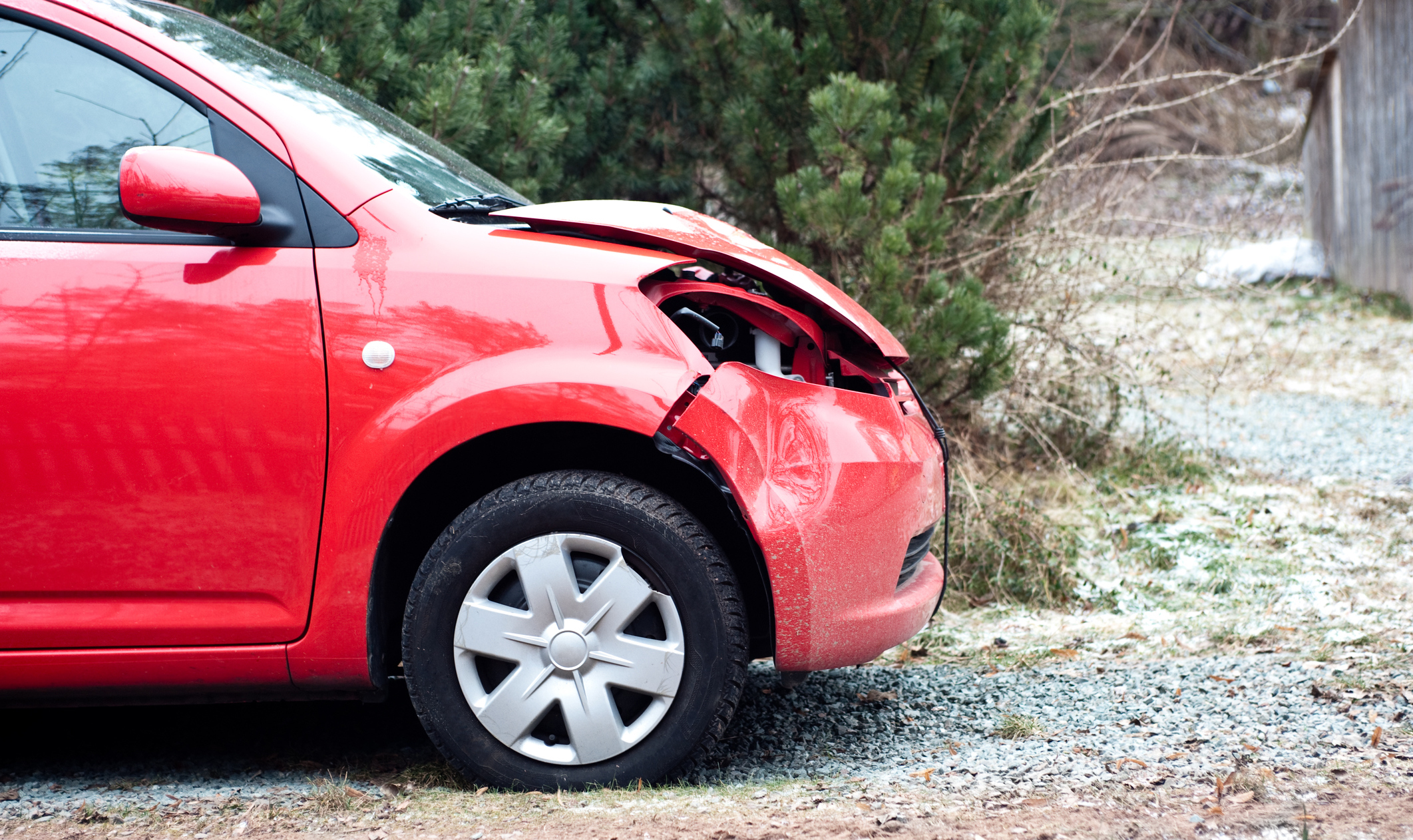 Picture of a car with a dented hood.