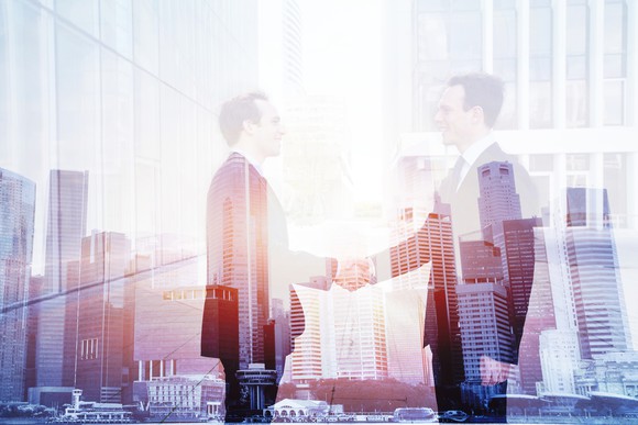 A business deal with handshake.