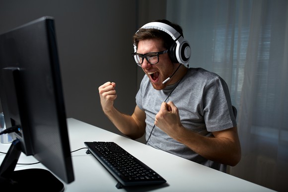 Man playing video games on a computer.