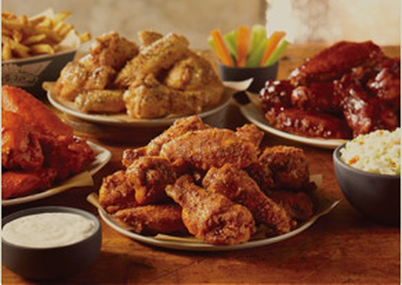 Various plates of chicken wings from Wingstop.