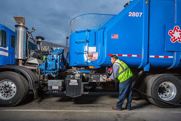 Republic services trash truck refueling with CNG.