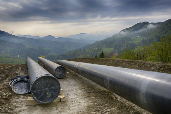 Construction of a pipeline in the mountains.