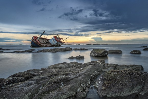 Shipwreck on rocks.