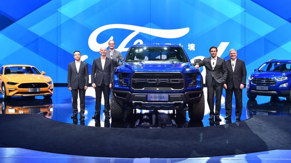 Ford executives surround the 2017 Raptor on a stage in China.