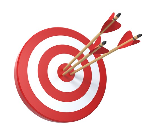 Bullseye target with three arrows in it.