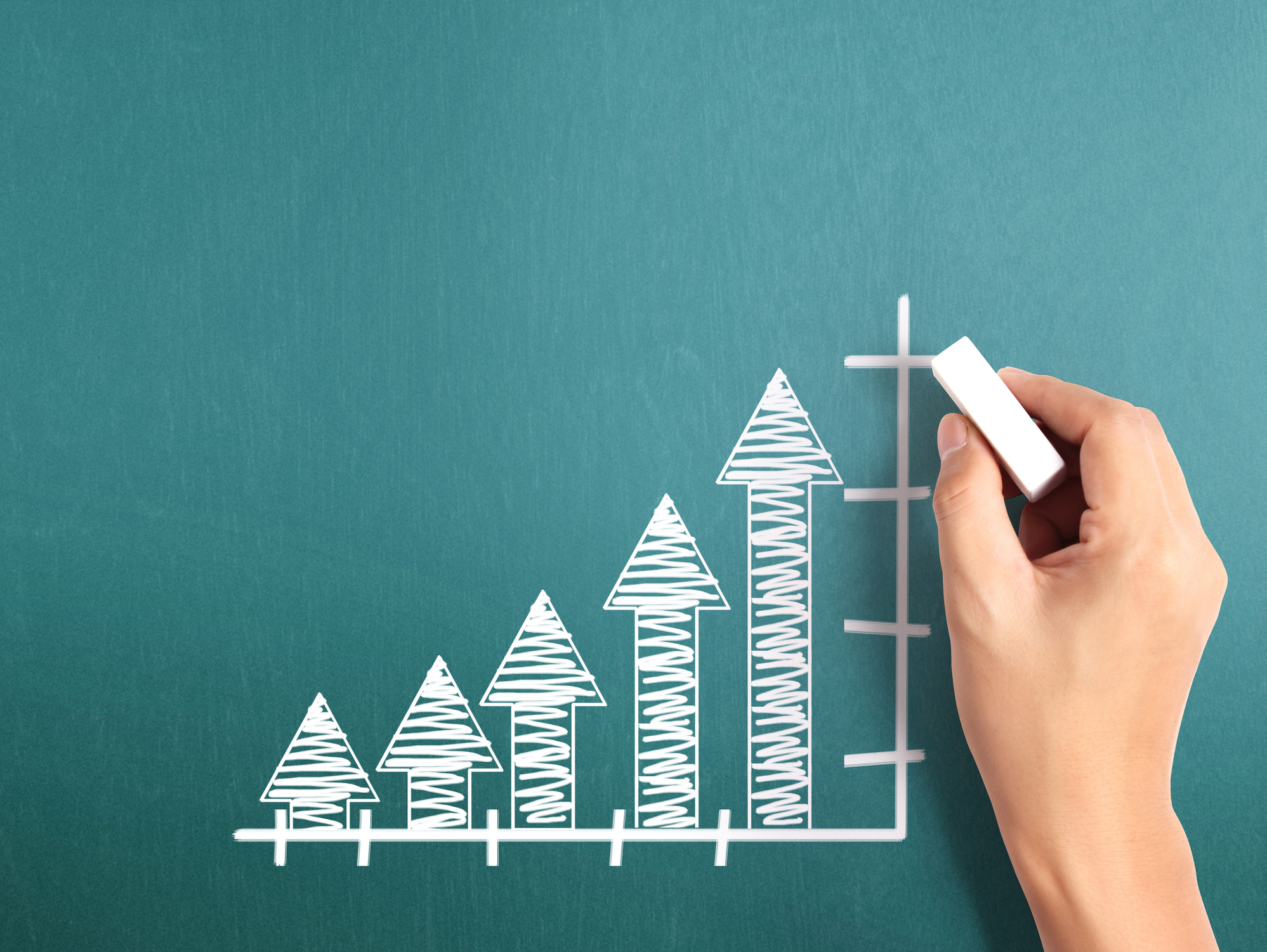 A stock chart showing gains, drawn on a chalkboard.