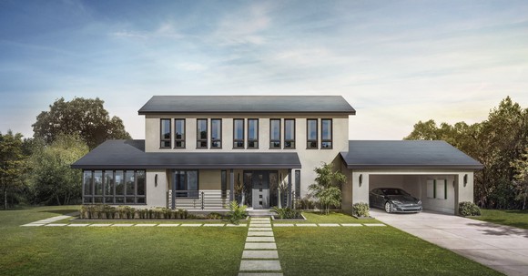 A home with Tesla Smooth Glass solar tiles, a Model S, and two Powerwalls
