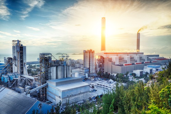 Power plant shown at sunset.