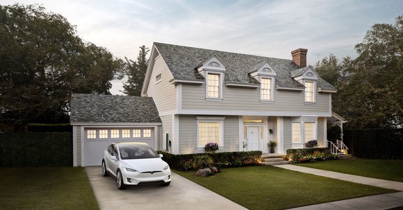 Rendering of home with solar roof and Tesla car in the driveway.