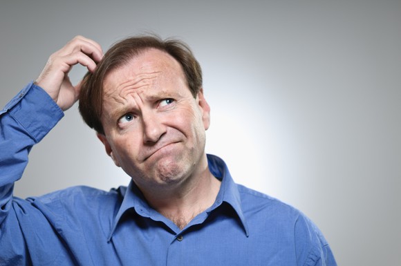 A pre-retiree scratching his head in confusion.