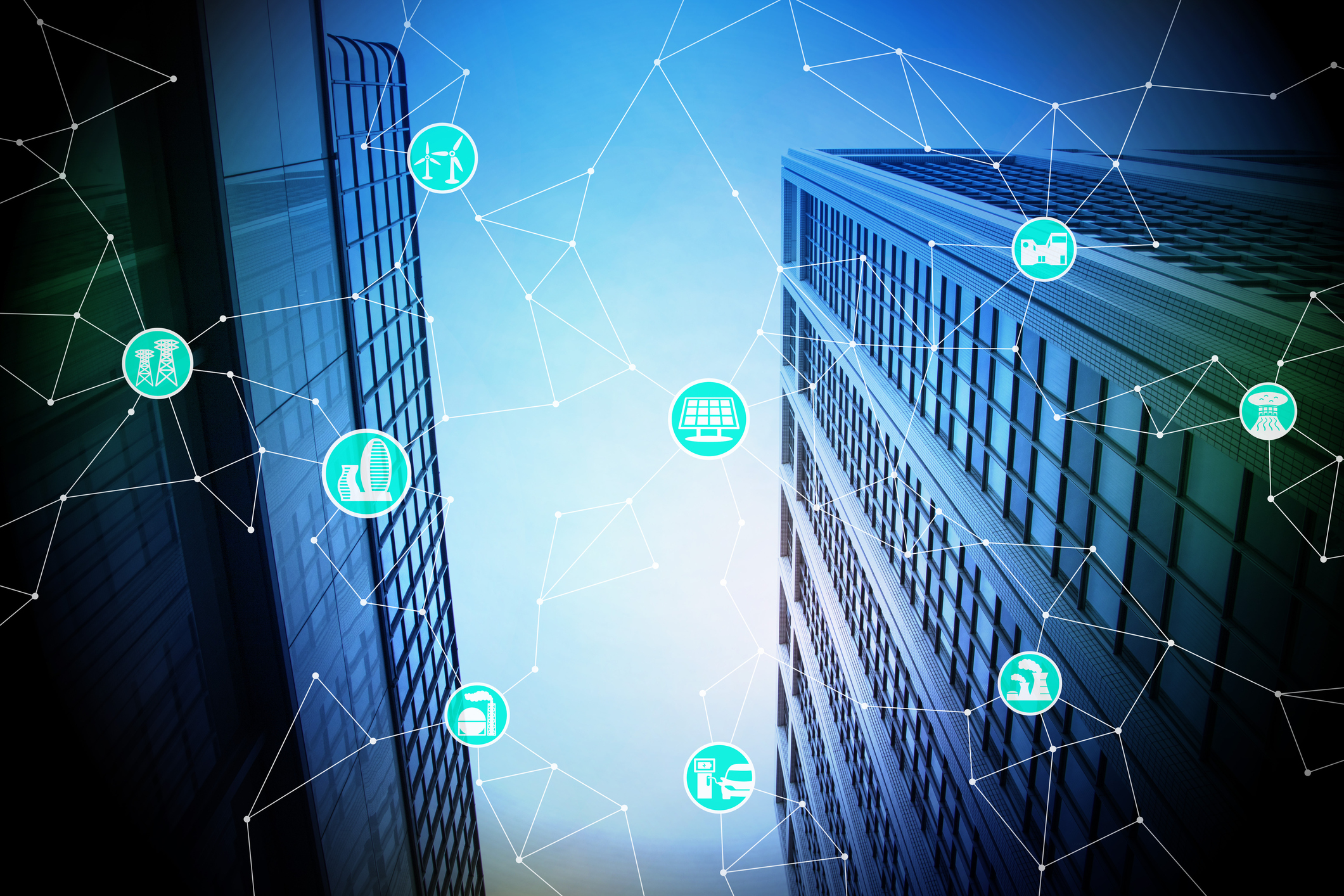 Image of a city with a graphic of connected devices overlaid on top of it.