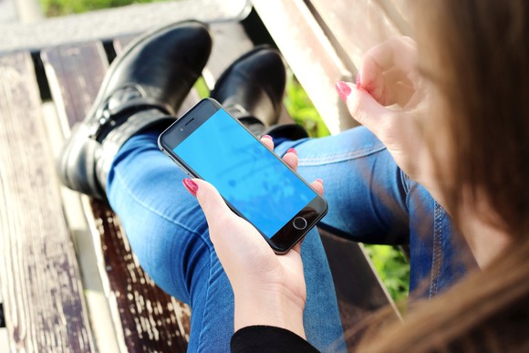 A smartphone is being held.
