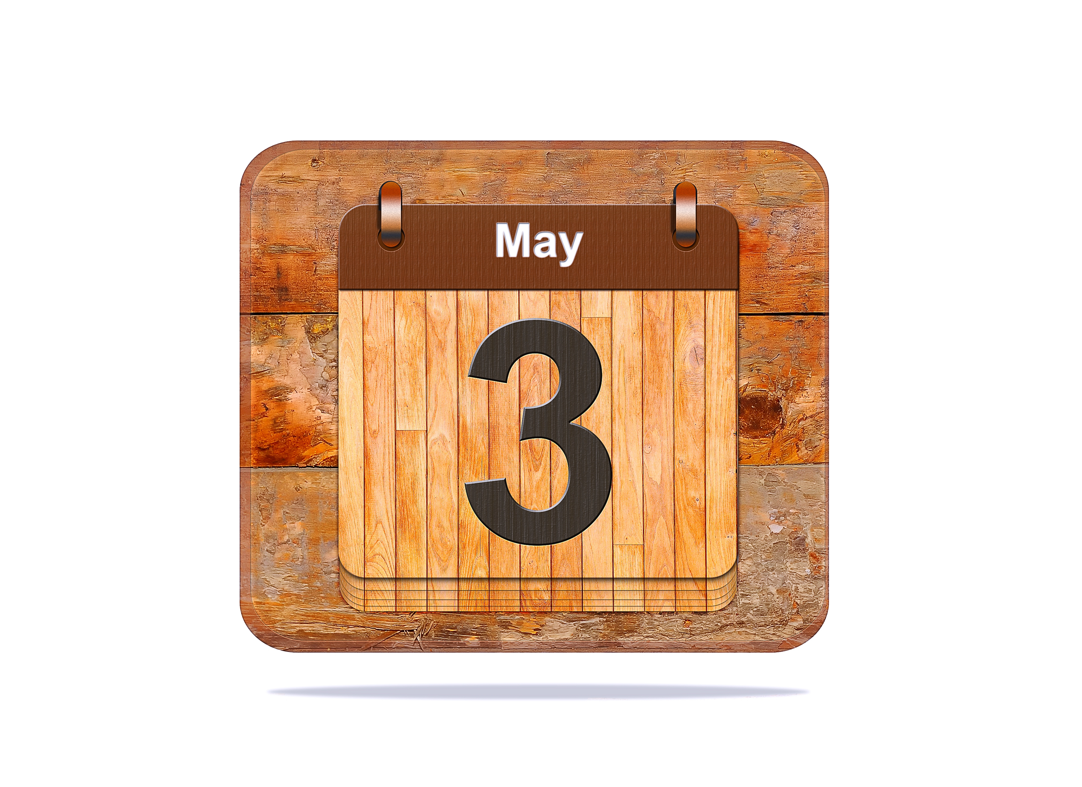 A wooden calendar showing a number three and the word "May."