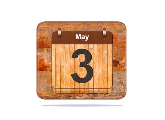 A wooden calendar showing a number three and the word "May."