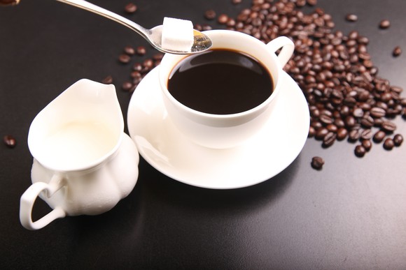 Coffee beans and a cup of coffee