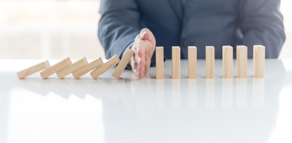 Chain of dominos falling, stopped in the middle.