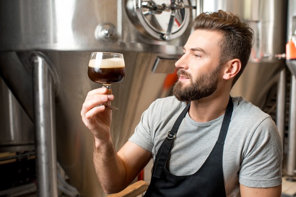 Craft brewer eying with love a sample beer