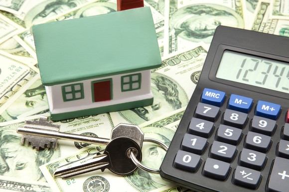 House, calculator, money, and keys.
