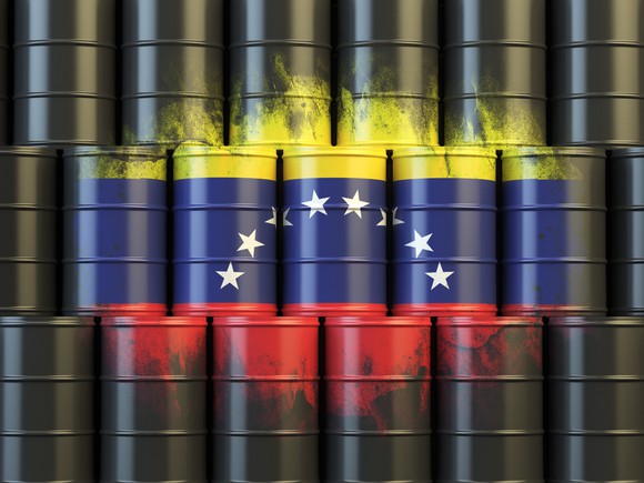 Venezuelan flag painted on oil barrels.