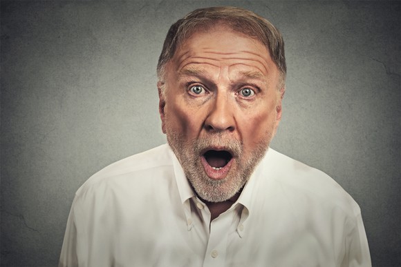An older man with a surprised look on his face.
