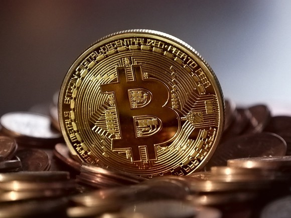 How To Bitcoin Nasdaq A Gold Coin With The Bitcoin Symbol Emblazoned On Front