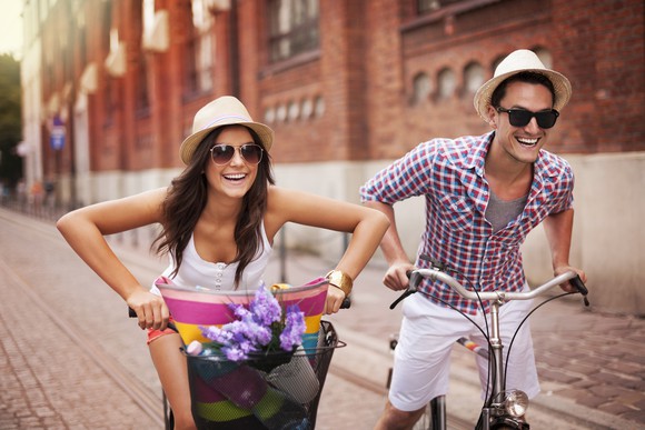 Couple riding bikes on vacation