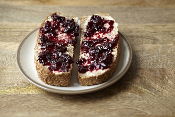 Blueberry jam spread on bread