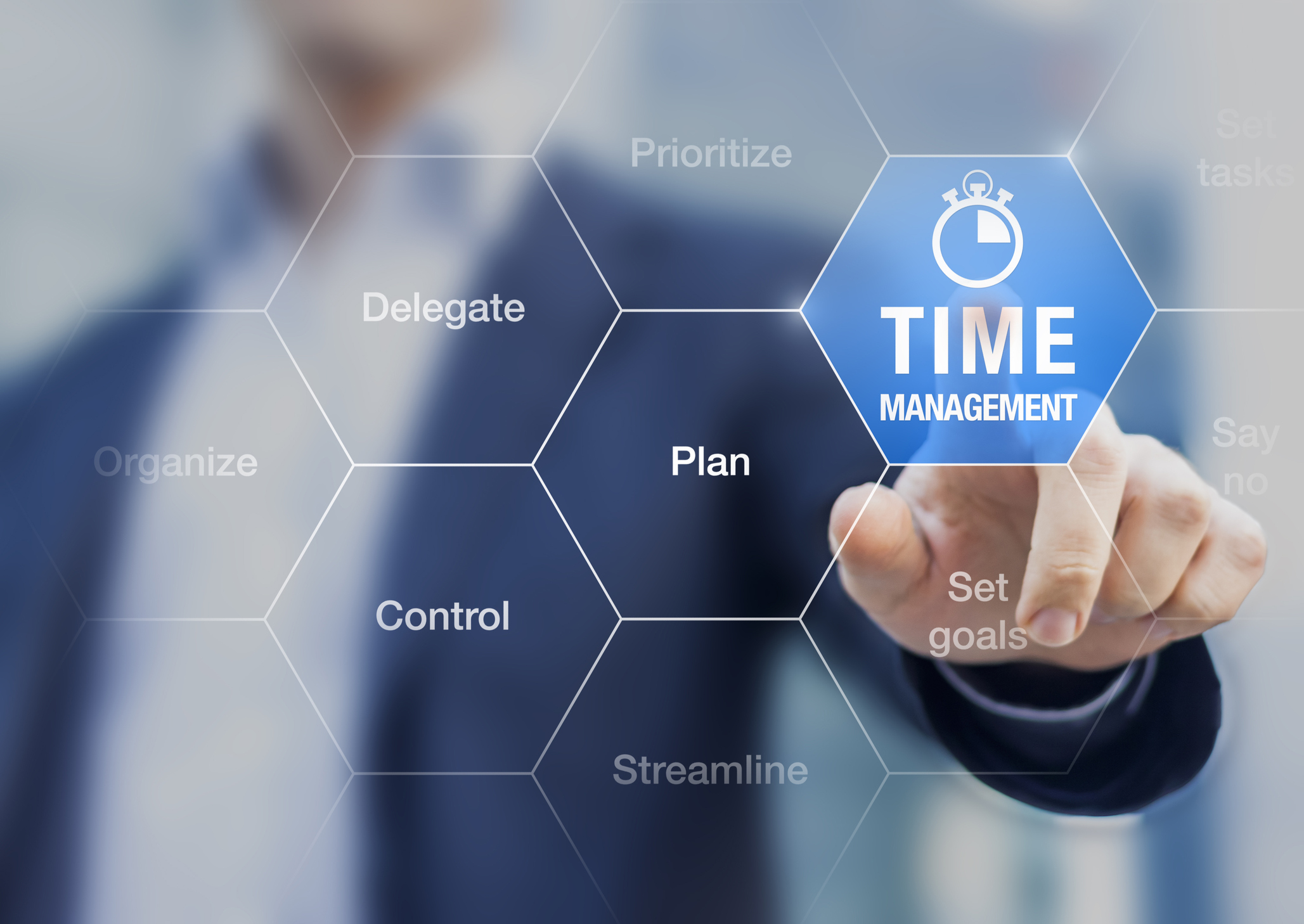 A man pointing to a "time management" icon