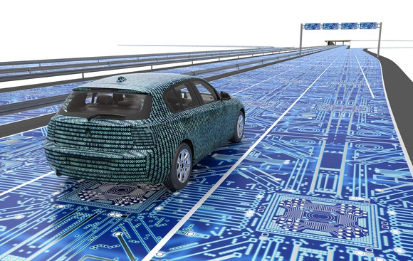 Self driving electronic computer car on road.