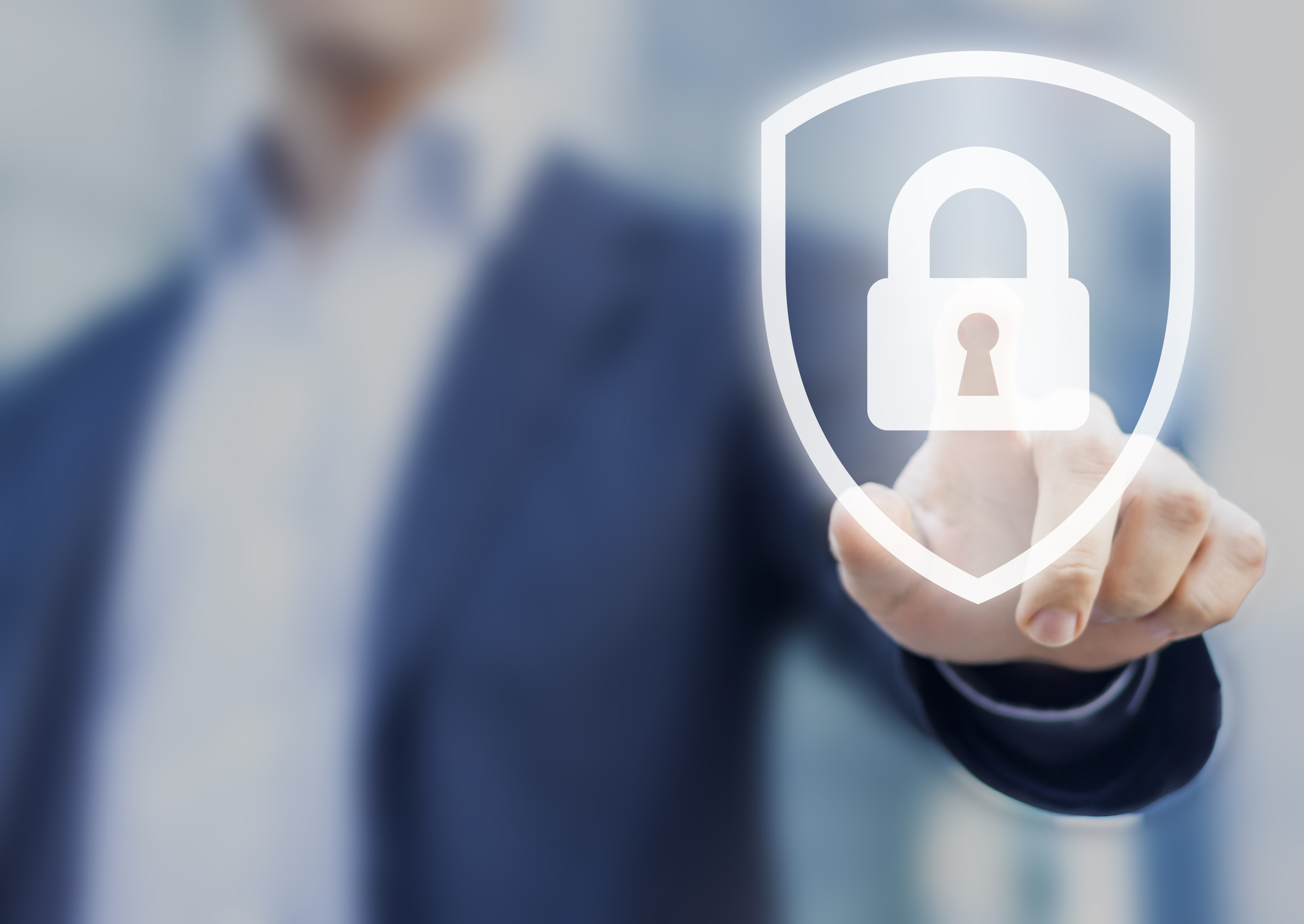 Man touching shield/lock icon