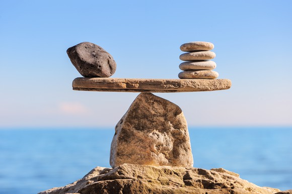 Rocks balanced on a beam.