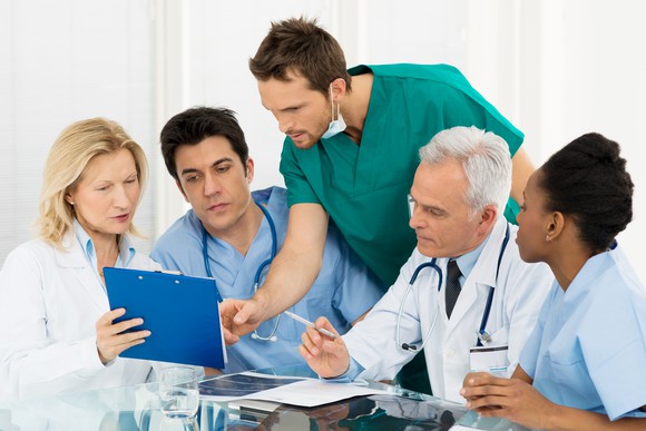 doctors looking concerned at data