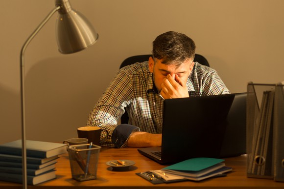 Tired man at his desk