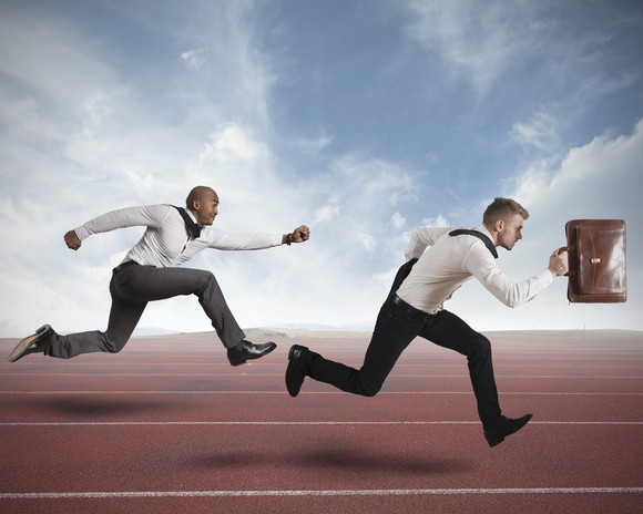 Two businessmen running a race.