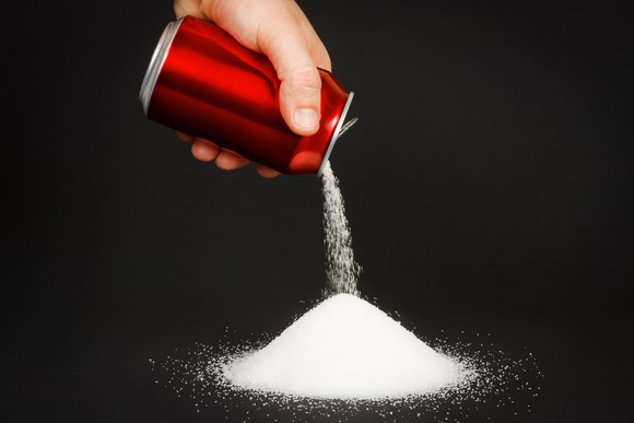 Sugar pouring out of soda can