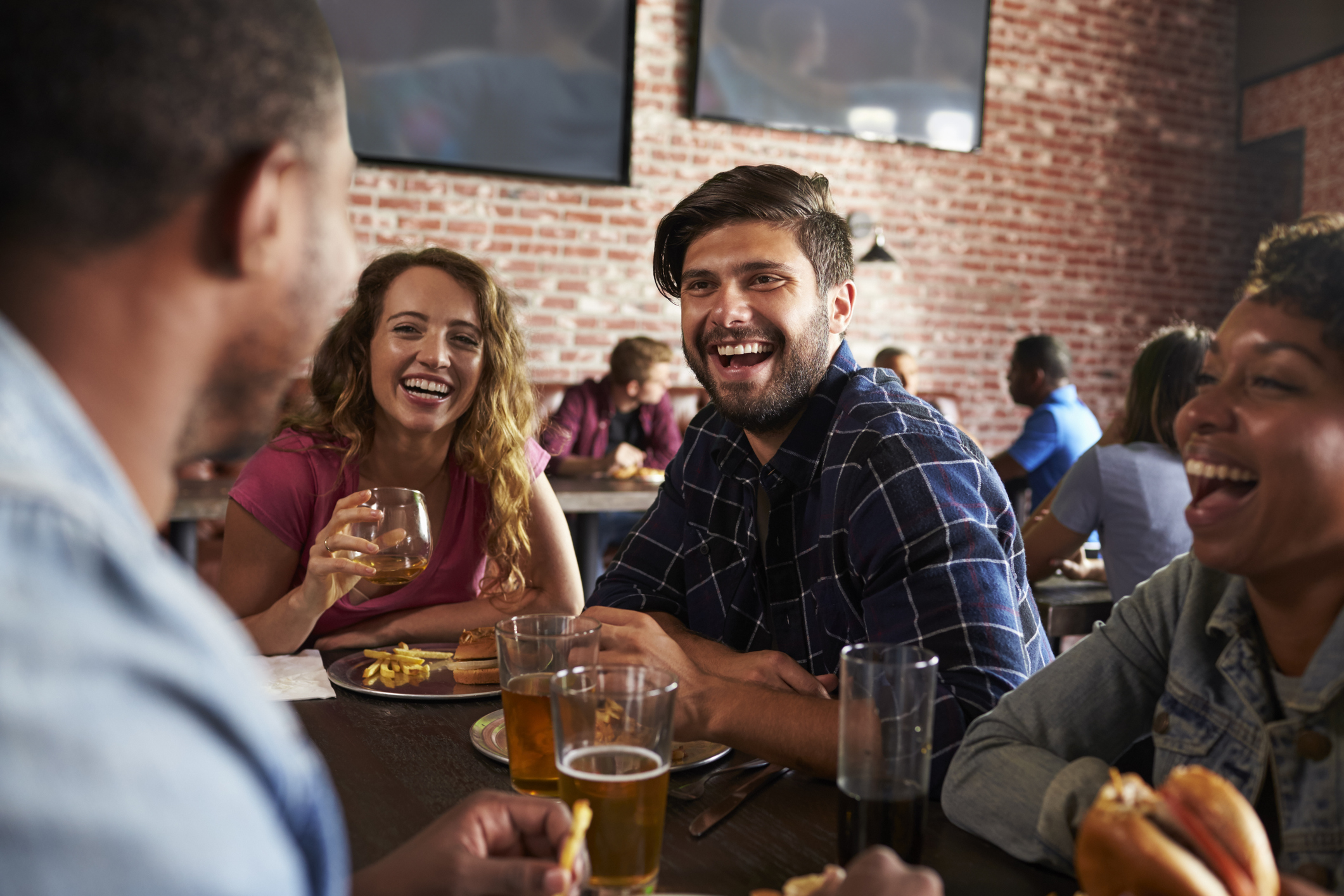 Friends eating at a sports bar.