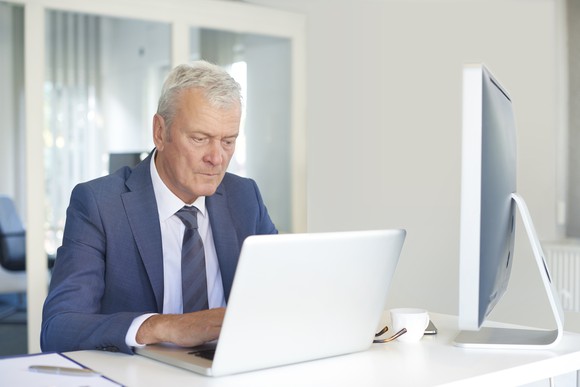 Senior male working at his desk