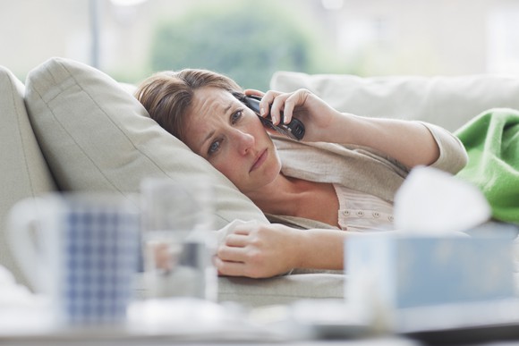 Sick woman on sofa