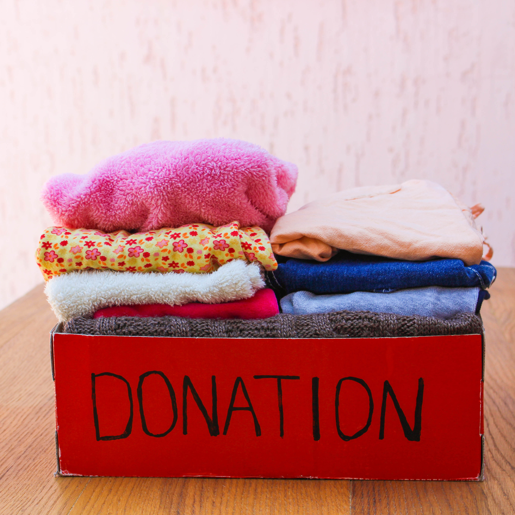 A donation box filled with clothes