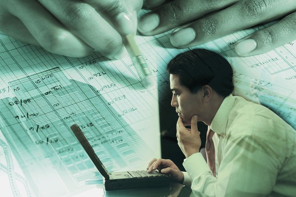 Business owner looking at financials.
