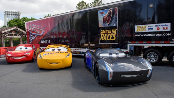 Three cars from the "Cars 3" tour, kicking off at Disney Springs.