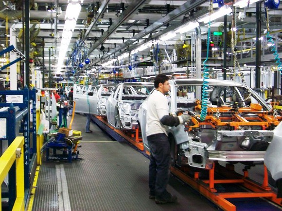 Partially-assembled vehicles on a factory assembly line