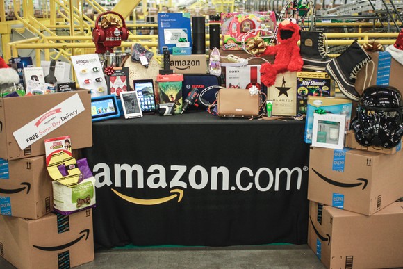 A table loaded with stuff from Amazon with an Amazon.com table cloth
